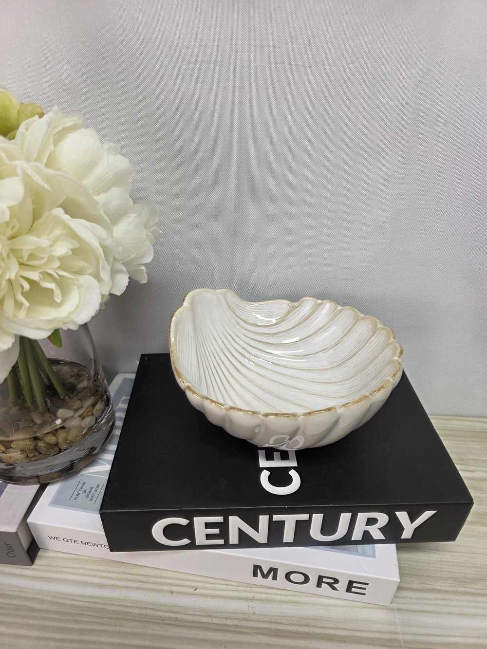 Cindy Crawford A Set of Two Off White Shell Ceramic Bowls with Tan Rim